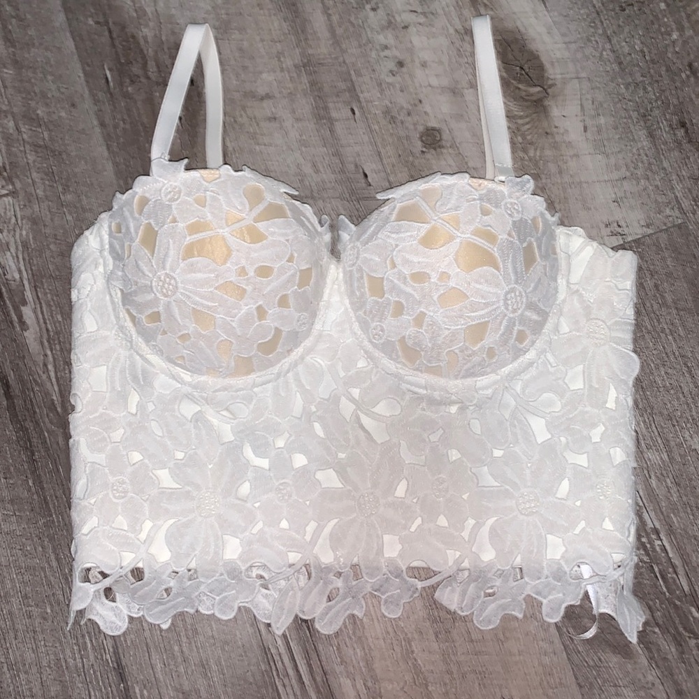 White strapless shirt. Comes with removable straps.